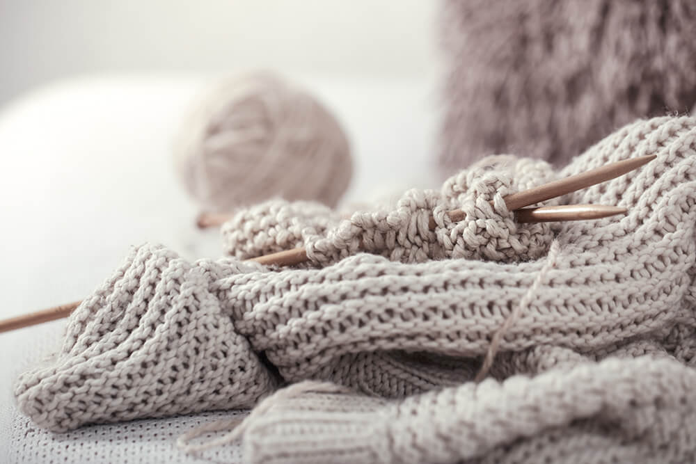 Knitting needles and ball of wool